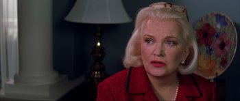 Movie still from “The Notebook” (2004), directed by Nick Cassavetes – An older woman with blonde hair and wearing a red jacket; Close Up shot, Over the shoulder angle