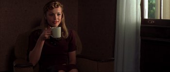 Movie still from “The Notebook” (2004), directed by Nick Cassavetes – A woman sitting on a chair holding a cup; Medium shot, Over the shoulder angle