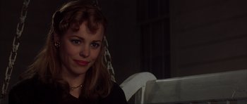 Movie still from “The Notebook” (2004), directed by Nick Cassavetes – A young woman sitting in a chair in a dark room; Close Up shot, Over the shoulder angle