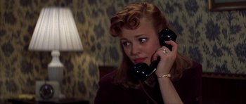 Movie still from “The Notebook” (2004), directed by Nick Cassavetes – A young woman is talking on a phone; Close Up shot, Over the shoulder angle