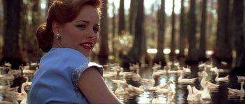 Movie still from “The Notebook” (2004), directed by Nick Cassavetes – A woman sitting in front of a flock of ducks; Close Up shot, Over the shoulder angle