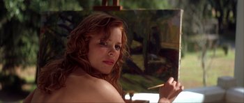 Movie still from “The Notebook” (2004), directed by Nick Cassavetes – A young woman holding a paintbrush in front of a painting; Close Up shot, Over the shoulder angle