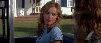 Movie still from “The Notebook” (2004), directed by Nick Cassavetes – A woman sitting in the back of a car in front of a house; Close Up shot, Over the shoulder angle