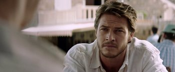 Movie still from “The November Man” (2014), directed by Roger Donaldson – A person wearing a white shirt; Close Up shot, Over the shoulder angle