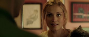 Movie still from “The November Man” (2014), directed by Roger Donaldson – A woman's face in front of a painting; Close Up shot, Over the shoulder angle