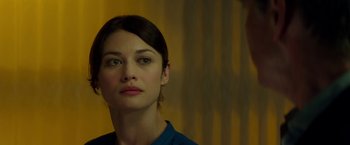 Movie still from “The November Man” (2014), directed by Roger Donaldson – A person looking at the camera; Close Up shot, Over the shoulder angle