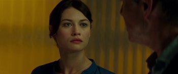 Movie still from “The November Man” (2014), directed by Roger Donaldson – A person looking at the camera; Close Up shot, Over the shoulder angle