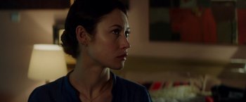 Movie still from “The November Man” (2014), directed by Roger Donaldson – A person looking to her left; Close Up shot, Over the shoulder angle