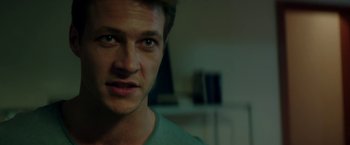 Movie still from “The November Man” (2014), directed by Roger Donaldson – A man's face in the dark; Close Up shot, Over the shoulder angle