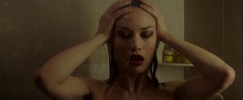 Movie still from “The November Man” (2014), directed by Roger Donaldson – A beautiful woman taking a shower in a bathroom; Close Up shot, Overhead angle