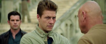 Movie still from “The November Man” (2014), directed by Roger Donaldson – A person wearing a shirt and tie; Close Up shot, Low angle