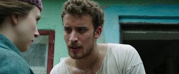 Movie still from “The Nun” (2018), directed by Corin Hardy – A person wearing a white shirt; Close Up shot, Low angle