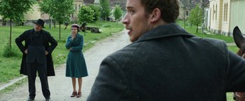 Movie still from “The Nun” (2018), directed by Corin Hardy – A man and a woman standing next to each other on the side of the road; Medium shot, Over the shoulder angle