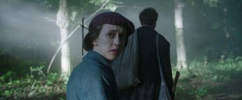 Movie still from “The Nun” (2018), directed by Corin Hardy – A woman in a hat standing next to a man in a hat; Close Up shot, Over the shoulder angle