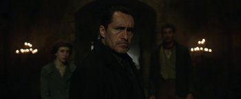 Movie still from “The Nun” (2018), directed by Corin Hardy – A person wearing a jacket; Close Up shot, Over the shoulder angle