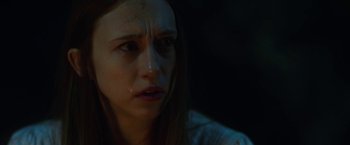 Movie still from “The Nun” (2018), directed by Corin Hardy – A person with a crying face; Close Up shot, Over the shoulder angle