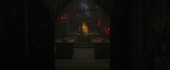 Movie still from “The Nun” (2018), directed by Corin Hardy – A clock in the middle of a dark room; Extreme Wide shot, High angle