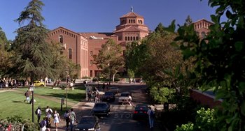 Movie still from “The Nutty Professor” (1996), directed by Tom Shadyac – A view of cars driving down the street; Extreme Wide shot, High angle