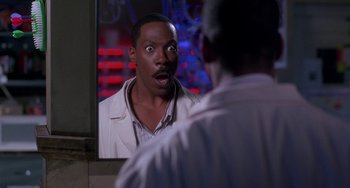 Movie still from “The Nutty Professor” (1996), directed by Tom Shadyac – A man looking at himself in the mirror; Close Up shot, Over the shoulder angle