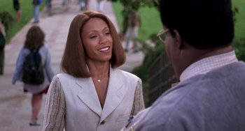 Movie still from “The Nutty Professor” (1996), directed by Tom Shadyac – A woman in a white jacket talking to a man in a white jacket; Close Up shot, Over the shoulder angle