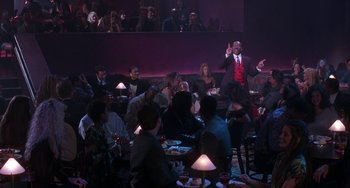 Movie still from “The Nutty Professor” (1996), directed by Tom Shadyac – A group of people sitting around a table; Wide shot, High angle