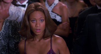 Movie still from “The Nutty Professor” (1996), directed by Tom Shadyac – A person with long hair; Close Up shot, Over the shoulder angle