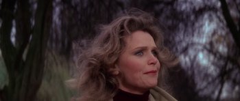 Movie still from “The Omen” (1976), directed by Richard Donner – A person wearing a jacket; Close Up shot, Over the shoulder angle