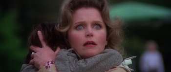 Movie still from “The Omen” (1976), directed by Richard Donner – A person wearing a scarf; Close Up shot, Low angle