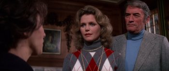 Movie still from “The Omen” (1976), directed by Richard Donner – A person wearing a sweater; Close Up shot, Over the shoulder angle