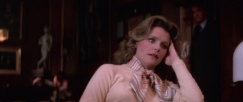 Movie still from “The Omen” (1976), directed by Richard Donner – A person wearing a neck tie; Close Up shot, High angle