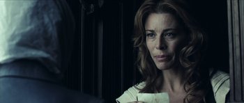 Movie still from “The Orphanage” (2007), directed by J.A. Bayona – A person holding a piece of paper; Close Up shot, Over the shoulder angle