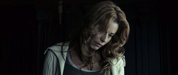 Movie still from “The Orphanage” (2007), directed by J.A. Bayona – A person with long red hair; Close Up shot, Low angle