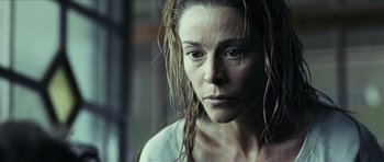 Movie still from “The Orphanage” (2007), directed by J.A. Bayona – A person with wet hair; Close Up shot, Low angle