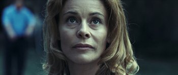 Movie still from “The Orphanage” (2007), directed by J.A. Bayona – A person's face looking at the camera; Close Up shot, Low angle