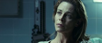 Movie still from “The Orphanage” (2007), directed by J.A. Bayona – A person looking at the camera; Close Up shot, Low angle