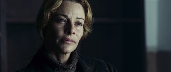 Movie still from “The Orphanage” (2007), directed by J.A. Bayona – A person wearing a jacket; Close Up shot, Over the shoulder angle