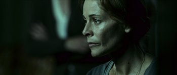 Movie still from “The Orphanage” (2007), directed by J.A. Bayona – A person looking at the camera; Close Up shot, Over the shoulder angle