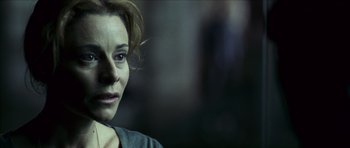 Movie still from “The Orphanage” (2007), directed by J.A. Bayona – A person looking at the camera; Close Up shot, Over the shoulder angle