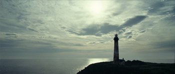 Movie still from “The Orphanage” (2007), directed by J.A. Bayona – A light house on top of a hill near the ocean; Extreme Wide shot, Low angle