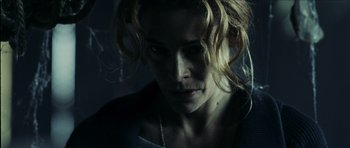 Movie still from “The Orphanage” (2007), directed by J.A. Bayona – A person with long blonde hair; Close Up shot, High angle