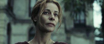 Movie still from “The Orphanage” (2007), directed by J.A. Bayona – A person looking at the camera; Close Up shot, Low angle