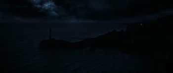 Movie still from “The Orphanage” (2007), directed by J.A. Bayona – A view of the ocean at night with a dark sky above it; Extreme Wide shot, High angle