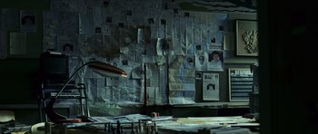 Movie still from “The Orphanage” (2007), directed by J.A. Bayona – A room filled with lots of papers on the wall; Wide shot, High angle
