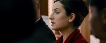 Movie still from “The Other Guys” (2010), directed by Adam McKay – A person wearing a suit and tie; Close Up shot, Over the shoulder angle