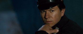 Movie still from “The Other Guys” (2010), directed by Adam McKay – A person wearing a hat; Close Up shot, Low angle