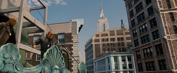 Movie still from “The Other Guys” (2010), directed by Adam McKay – A view of the empire state building from a city street corner; Extreme Wide shot, Low angle