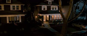 Movie still from “The Other Guys” (2010), directed by Adam McKay – A house that is lit up at night time; Extreme Wide shot, High angle