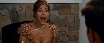 Movie still from “The Other Guys” (2010), directed by Adam McKay – A beautiful young lady holding a cigarette in her mouth; Close Up shot, Over the shoulder angle