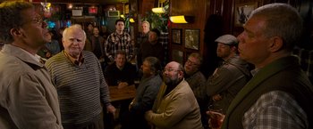Movie still from “The Other Guys” (2010), directed by Adam McKay – A group of people sitting in a room; Medium shot, High angle