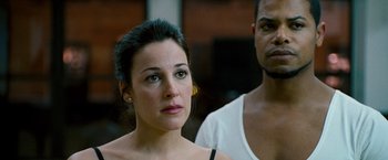 Movie still from “The Other Guys” (2010), directed by Adam McKay – A woman and a man standing next to each other; Close Up shot, Over the shoulder angle